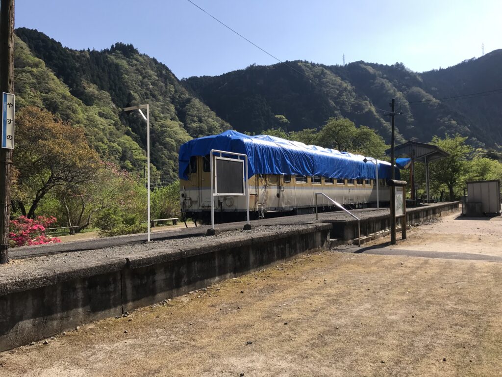 A train with a blue sheet